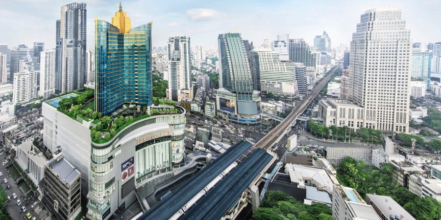 Aerial perspective of Bangkok featuring the Grande Centre Point Hotel Terminal 21 and the bustling cityscape.